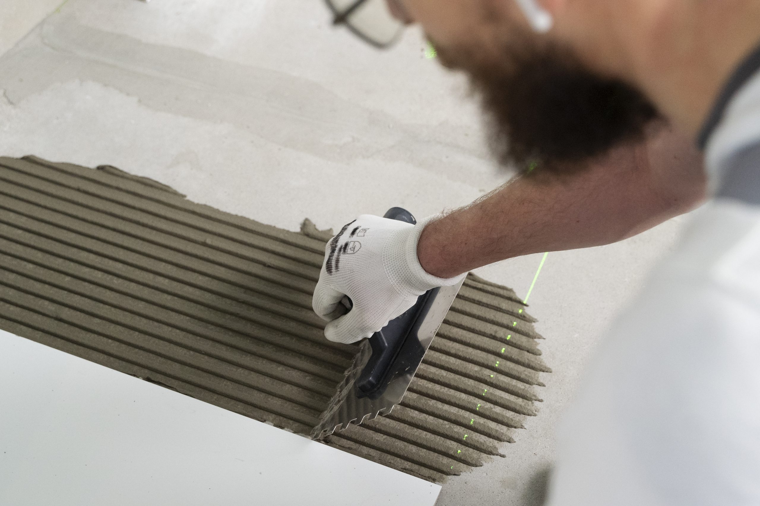 tiler working renovation apartment